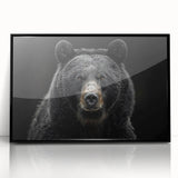 Framed wall art featuring a striking black bear design, showcasing intricate details and a sleek acrylic finish, perfect for nature enthusiasts and modern decor.