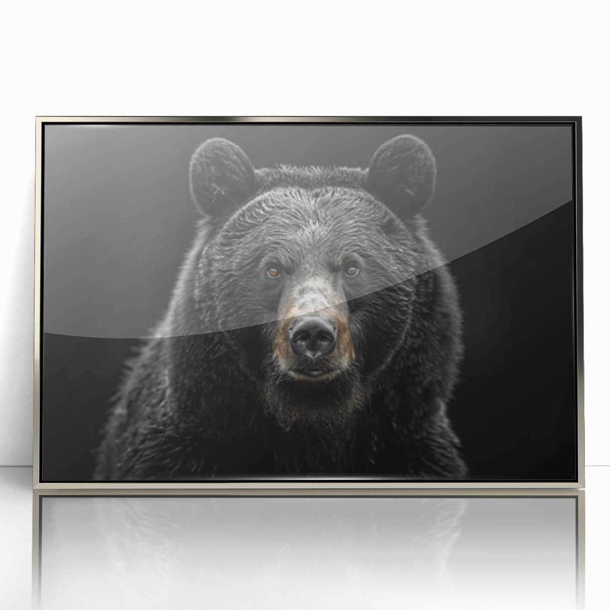 Framed wall art showcasing a striking black bear design in acrylic with a sleek silver frame, perfect for nature-themed decor. Ideal for wildlife enthusiasts.