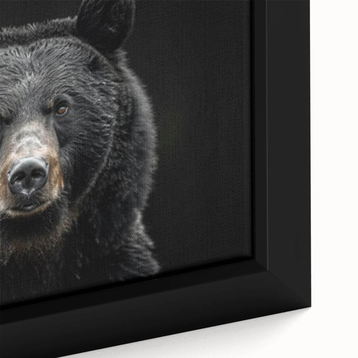 Close-up of a framed canvas wall art piece featuring a striking black bear design, showcasing intricate details and rich colors, perfect for nature lovers.