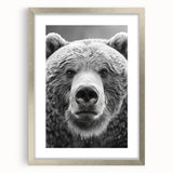 Framed wall art showcasing a black bear design with a silver mat, perfect for rustic home decor and nature enthusiasts. Ideal for enhancing living spaces.