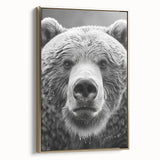Framed canvas wall art featuring a striking black bear design with gold accents, showcased from the side to highlight its artistic details and elegance.