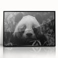 Framed acrylic wall art featuring a playful panda bear design, presented in a sleek black frame, perfect for children's rooms or playful decor.