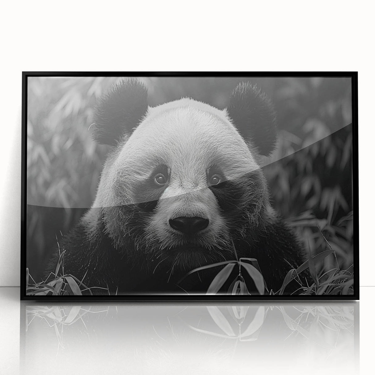 Framed acrylic wall art featuring a playful panda bear design, presented in a sleek black frame, perfect for children's rooms or playful decor.