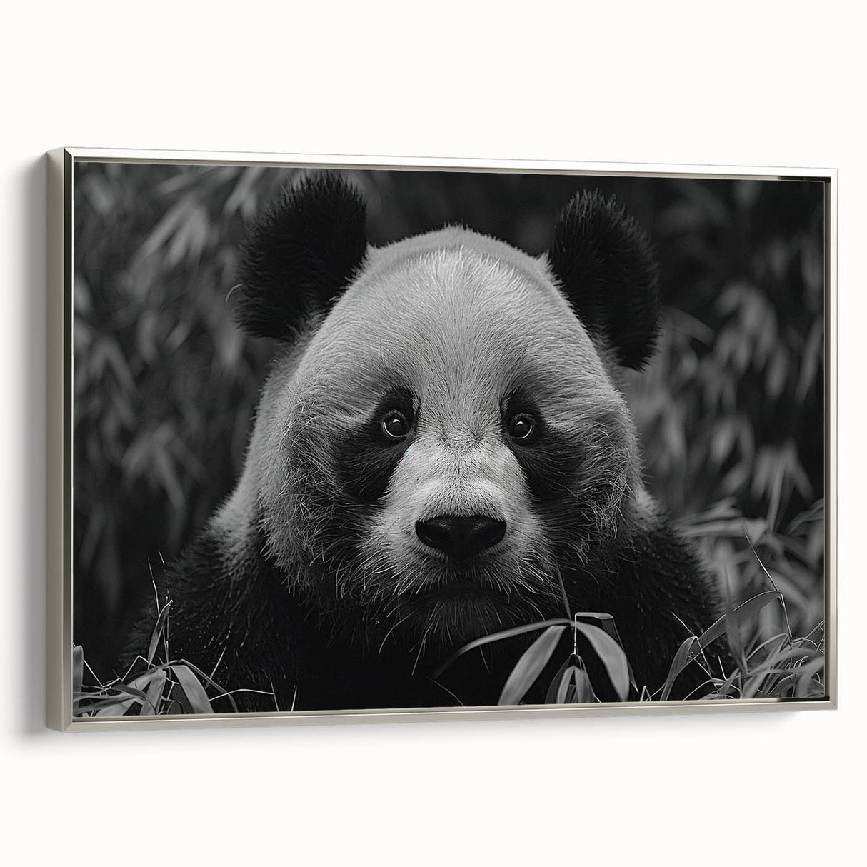 Framed wall art featuring a panda bear design on a textured canvas, displayed in a sleek silver frame, ideal for adding a whimsical touch to modern home decor.