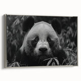 Framed wall art featuring a panda bear design on a textured canvas, displayed in a sleek silver frame, ideal for adding a whimsical touch to modern home decor.