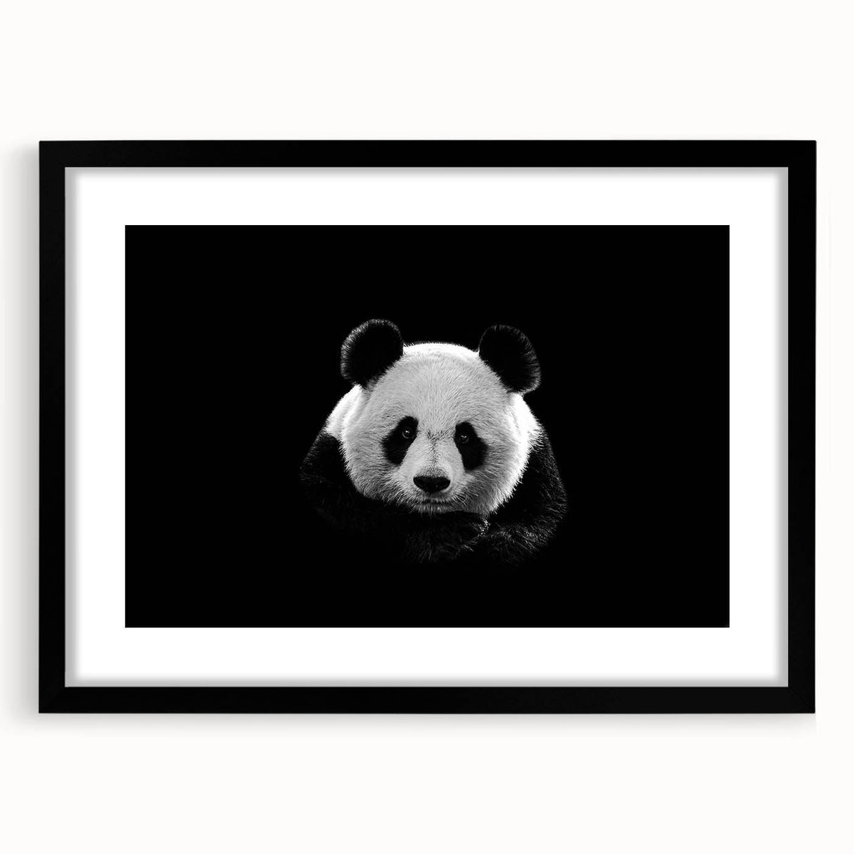 Panda bear wall art collection framed in a sleek black frame, showcasing a playful panda design with a white mat, perfect for children's room decor.