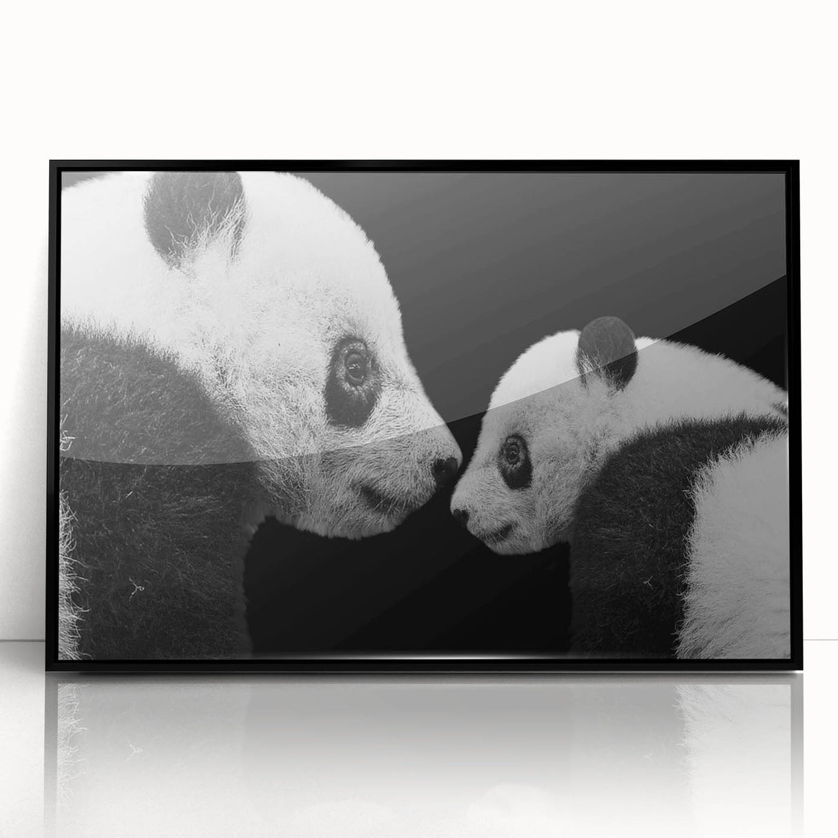 Framed wall art featuring a panda bear design in vibrant colors, presented in an acrylic frame with a sleek black border, ideal for children's rooms or playful decor.