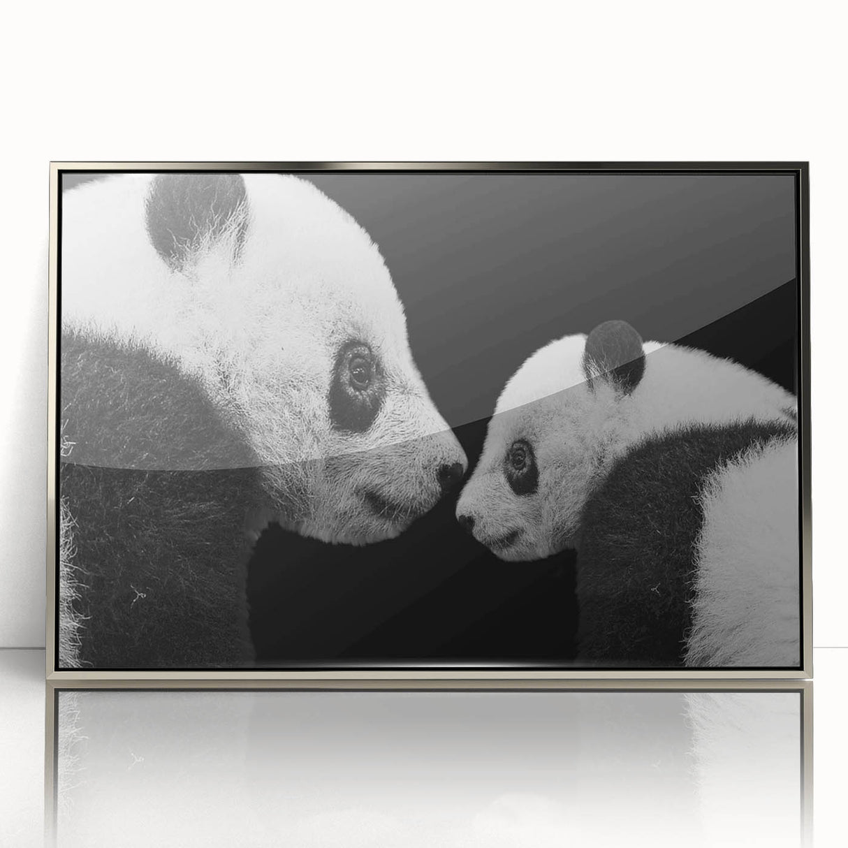 Framed acrylic wall art featuring a playful panda bear design on a silver background, ideal for children's rooms or nurseries, adding a whimsical touch to home decor.