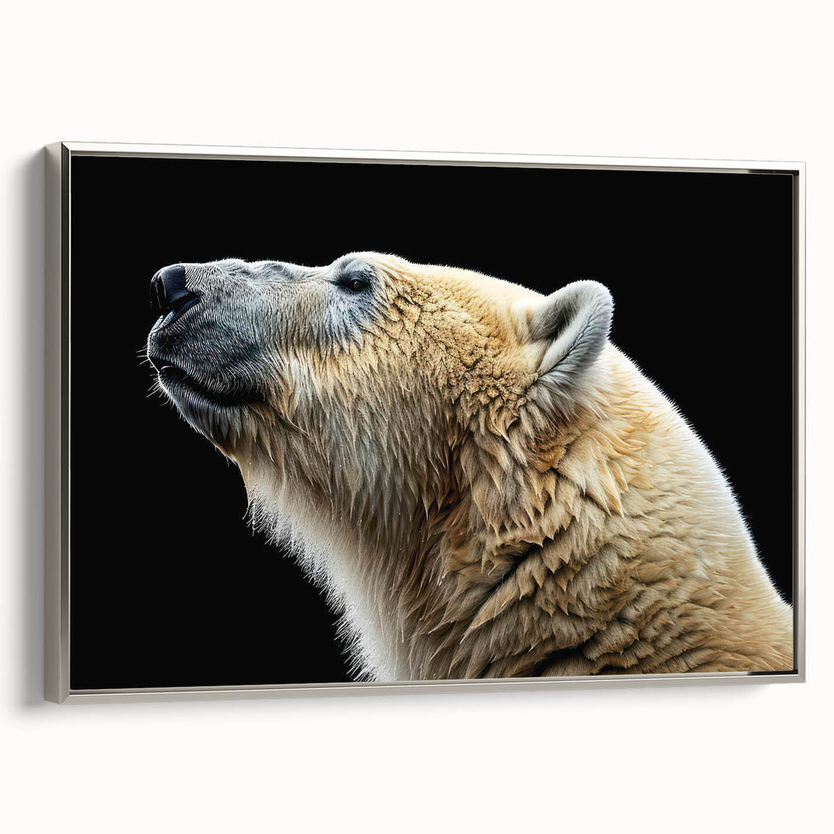 Framed canvas wall art showcasing a polar bear design with a sleek silver frame, highlighting the majestic animal against a minimalist background, ideal for modern decor.