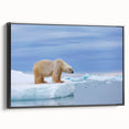 Framed canvas wall art featuring a polar bear design, displayed against a black background, showcasing a modern and minimalist aesthetic ideal for wildlife lovers.