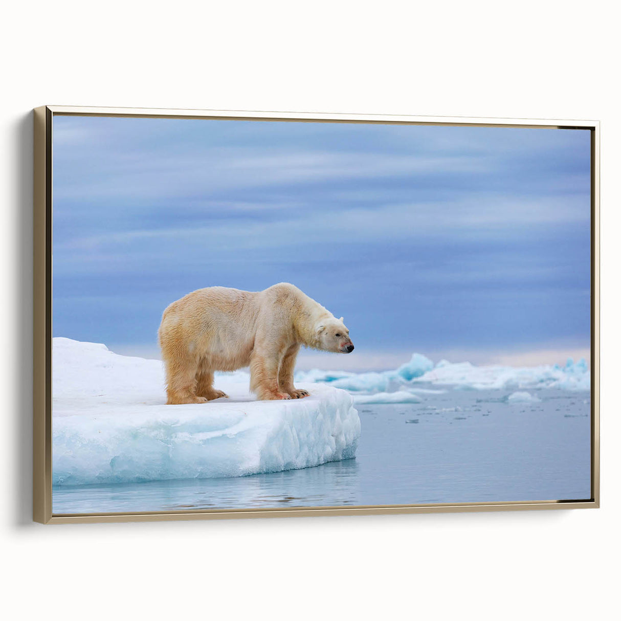 Framed wall art featuring a polar bear design on a textured canvas, elegantly displayed with a gold frame, ideal for adding a touch of nature to modern decor.