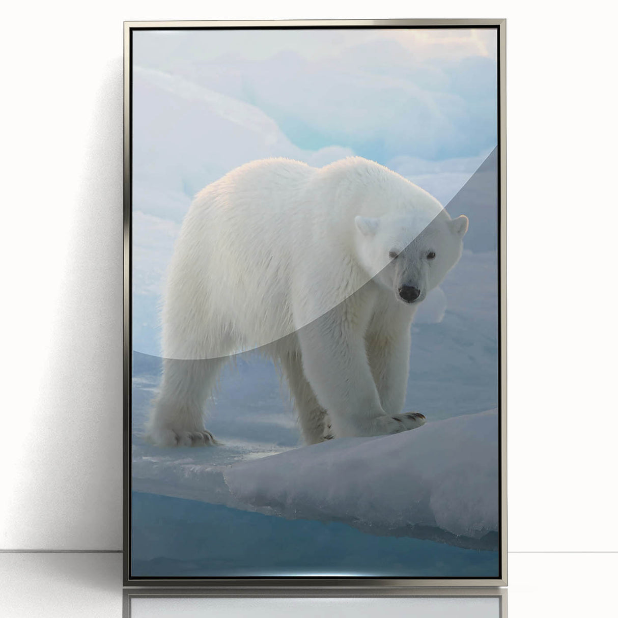 Framed wall art featuring a stunning polar bear design, set in an elegant silver frame, showcasing detailed textures and vibrant colors that enhance any decor.