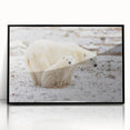 Framed acrylic wall art showcasing a striking polar bear design, featuring a sleek black frame and vibrant colors, perfect for home decor or wildlife enthusiasts.