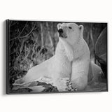Framed canvas wall art featuring a striking polar bear design in black, showcasing its side profile against a minimalist backdrop, perfect for modern decor.