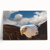 Stretched canvas wall art showcasing a vibrant bird design in bold colors, elegantly leaning against a wall, perfect for modern decor enthusiasts.