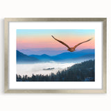 Framed wall art featuring a contemporary design of birds in flight, showcasing intricate details and a sleek silver frame, perfect for home decor enhancement.