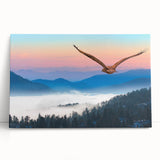 Stretched canvas wall art featuring a vibrant, abstract design of birds in flight, showcasing shades of blue and orange, perfect for modern home decor.
