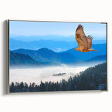 Framed canvas wall art featuring a vibrant design of birds in flight, elegantly displayed with a silver frame, perfect for enhancing modern home decor.