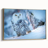 Framed canvas wall art showcasing a striking birds of prey design with rich gold accents, positioned elegantly for side view display in a modern interior setting.