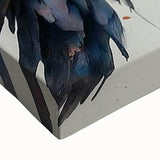 Close-up of a vibrant, stretched canvas wall art piece depicting a colorful bird design, featuring intricate details and textures, perfect for home decor.