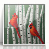 Framed wall art featuring a vibrant cardinal bird design, displayed in a white frame with a sleek acrylic finish, perfect for enhancing home decor.
