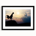 Framed wall art featuring a whimsical chicken design with vibrant colors, displayed in a sleek black frame with a white mat, perfect for home decor.