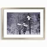 Framed wall art featuring a silver mat with a crane design, ideal for home decor. The artwork showcases intricate details and elegant colors, enhancing any interior space.