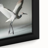 Close-up of a framed canvas wall art featuring an elegant crane design with intricate details, ideal for enhancing home decor and showcasing artistic flair.