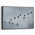 Framed wall art featuring a striking crane design in black, showcasing elegant lines and textures against a minimalist background, perfect for modern decor.