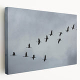 Stretched canvas wall art featuring a graceful crane design in soft hues of blue and white, ideal for adding elegance to home decor.