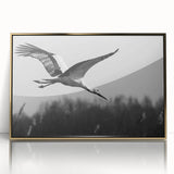 Framed wall art featuring a stylish gold-accented crane design, beautifully displayed in an acrylic frame, perfect for modern home decor and art enthusiasts. The elegant composition adds a touch of sophistication to any interior space.