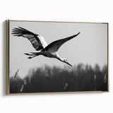 Framed canvas wall art featuring an elegant crane design in gold tones, showcased from a side view, perfect for adding a touch of sophistication to modern decor.