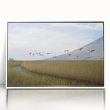 Framed wall art featuring a serene crane design in soft pastel colors, set against a white background, ideal for modern home decor. This elegant piece enhances interior spaces with a touch of nature-inspired beauty.