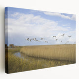 Stretched canvas wall art featuring an elegant crane design in soft blues and whites, showcasing a serene nature scene perfect for modern home decor.