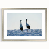 Elegant silver-framed wall art featuring a graceful crane design, perfect for home decor. The artwork is presented with a mat for enhanced visual appeal, suitable for modern interiors.