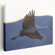 Elegant stretched canvas wall art featuring a serene crane design in soft hues of blue and gray, perfect for enhancing modern home decor.