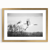 Framed wall art featuring a graceful crane design in gold tones, set against a neutral backdrop, perfect for adding elegance to home decor.