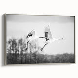 Framed wall art featuring an elegant crane design in silver tones, showcasing a side view of the canvas with a sleek modern frame, perfect for contemporary decor.