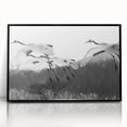Framed wall art featuring a minimalist black crane design on an acrylic surface, showcasing elegant lines and modern aesthetic, perfect for contemporary decor.