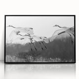 Framed wall art featuring a minimalist black crane design on an acrylic surface, showcasing elegant lines and modern aesthetic, perfect for contemporary decor.
