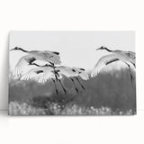 Elegant stretched canvas wall art featuring a crane design in soft pastel colors, leaning against a neutral wall, ideal for modern home decor.