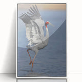 Framed wall art showcasing a graceful crane design in a minimalist style, featuring a white frame and acrylic glass, ideal for modern home decor.