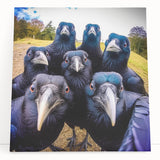 Stretched canvas wall art featuring a detailed design of crows and ravens in dark hues, leaning against a neutral background, perfect for enhancing modern decor.