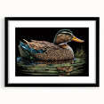 Framed black wall art featuring a minimalist duck design, accented with a white mat, ideal for modern home decor and nature-themed interiors.