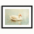 Framed wall art featuring a duck design in a sleek black frame with a white mat, ideal for home decor, showcasing vibrant colors and elegant details.
