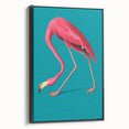 Framed canvas wall art featuring a vibrant flamingo design in pink and green tones, showcased in a stylish black frame, ideal for modern home decor.