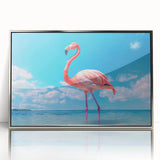 Framed wall art featuring a vibrant flamingo design in shades of pink and orange, set against a sleek silver-acrylic frame, perfect for modern home decor.