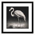 Stylish black-framed wall art featuring a vibrant flamingo design against a soft pastel background, perfect for modern home decor and adding a tropical touch.