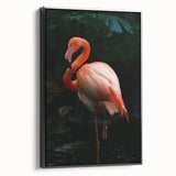 Framed wall art featuring a vibrant flamingo design on canvas, showcasing bold pink hues against a sleek black frame, ideal for adding a tropical touch to modern decor.