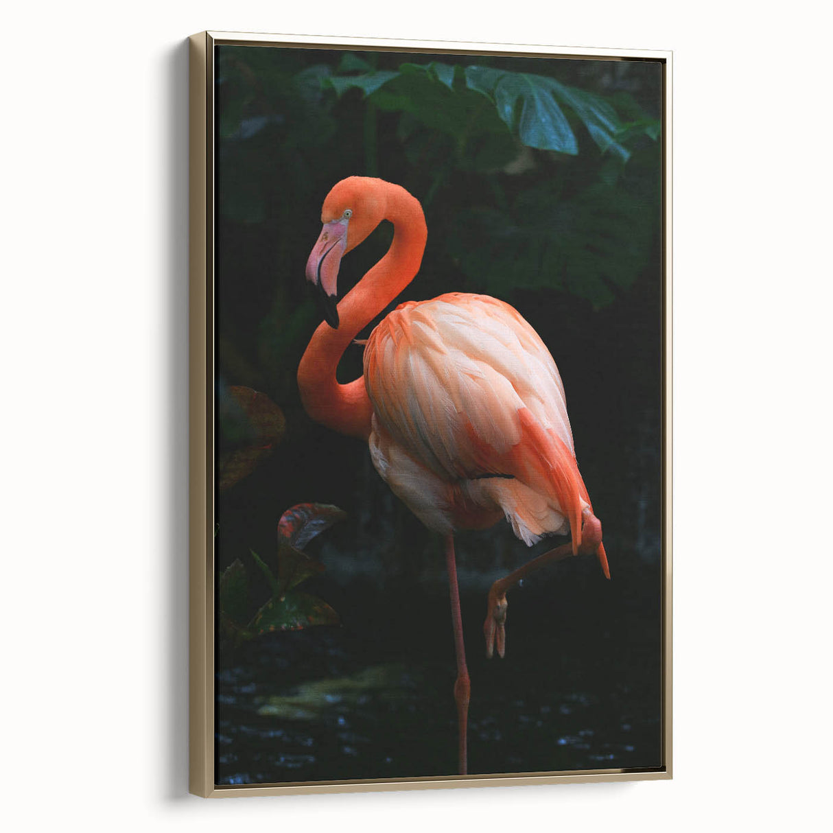 Framed canvas wall art showcasing a vibrant flamingo design in gold tones, elegantly displayed from the side. Perfect for modern decor, adding a tropical touch to any room.